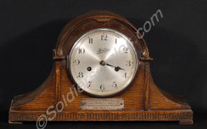 Mantlepiece clock in dark oak case. Presented to S