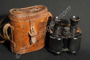Pair of binoculars with strap and case. Engraved '