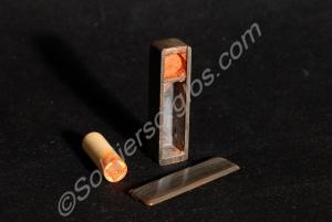 Seal with case containing red wax. Taken from a de