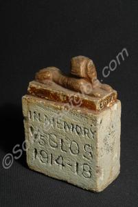 Stone door stop with brown sphinx. Painted white a