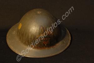 Steel helmet with a leather chin strap. Decorated