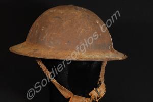 Steel helmet with broken canvas chin strap. 1941.