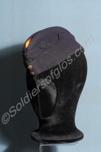 Blue side cap with red piping and primrose crown.