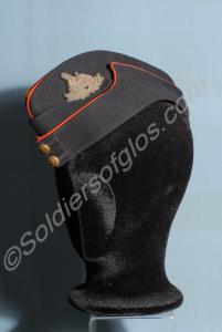 Officer's blue side cap with yellow crown, red pip