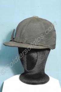 Riding helmet with black silk cover and peak. Size