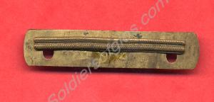 Brass wound strip with back plate, no. 4. c. 1918.