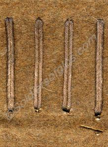Four wound strips, twisted brass laid on khaki ser