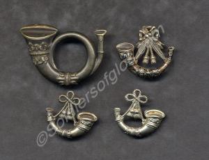 Four post horn badges, three different sizes. Beli