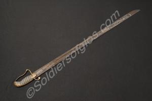 Engraved sword with 1.5 inch wide blade, brass hil