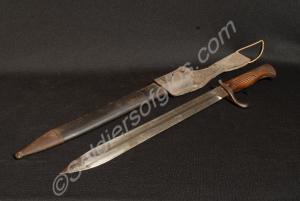Bayonet and leather scabbard with steel tip, and l