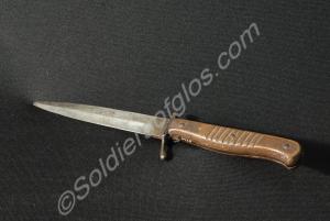 German dagger with wooden handle. The blade is 15.