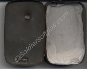 Small tin with lid with bullet hole through it. Pr