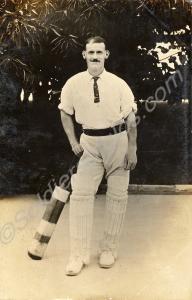 A postcard depicting a soldier in cricket gear. Gl