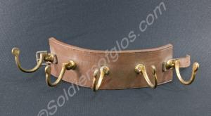 A leather coat hanger used to hang up coats in ten