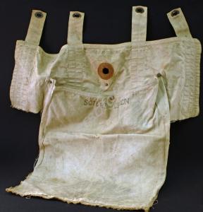 White canvas bag with straps used  in plane for 'S