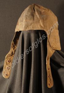 Canvas flying helmet covered in oil. Property of L