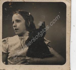 Photograph of young girl with dog. Belonged to 946