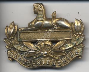 Front badge made into brooch and painted gold. No