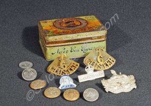Tin box (Players Navy Cut Cigarettes) with badges