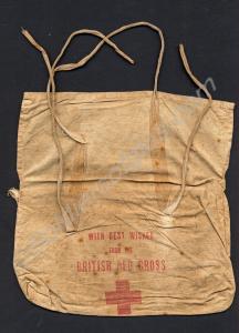 Cloth Red Cross Bag containing a food parcel. Writ