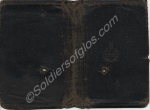 Leather wallet containing four black and white pho