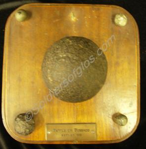 Wooden plinth 8 ins x 8 ins. With one 3 pdr rounds