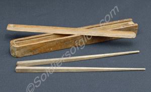 One pair of wooden Japanese chopsticks in wooden b