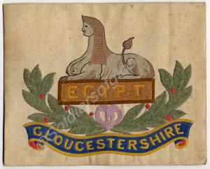Needlework square mounted on card.  Gloucestershir