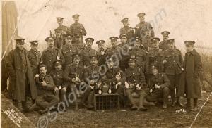 Informal group of soldiers with beer and dog, c. 1