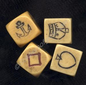 Four 'Crown and Anchor' dice played by soldiers in