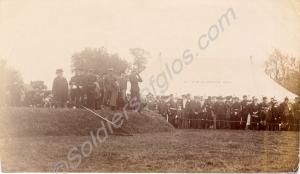 Shooting competition, with tent in background bear