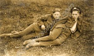 Two soldiers lying on the grass. Gloucestershire R