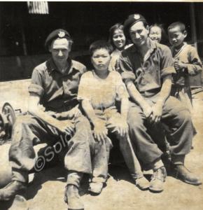 Two soldiers with Korean children. 1st Battalion,