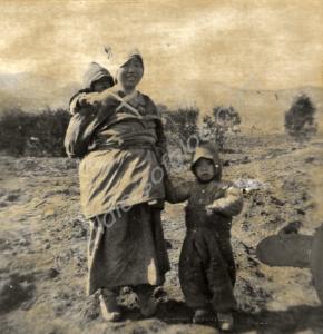 Korean woman with two young children. 1st Battalio