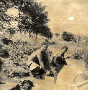 Washing  clothes in a stream with some Korean loca