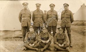 Eight Gloucestershire Regiment soldiers at camp, 1