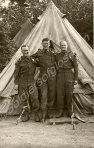 Three Gloucestershire Regiment soldiers outside a