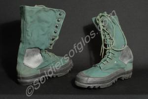 One pair of green canvas and black rubber jungle b