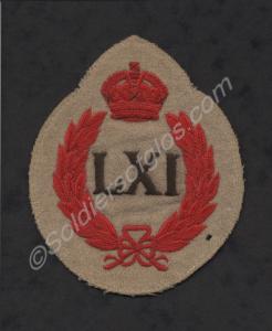 Red and buff worsted oval sports shirt badge 'LXI'