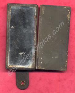 Shaving mirror in tin case with hinged cover over
