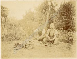 Cobblers at work in a garden.   Reverse: " What do