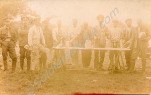 Group of soldiers posing with food and drink. Unit