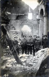 Group of soldiers standing inside a ruined church.