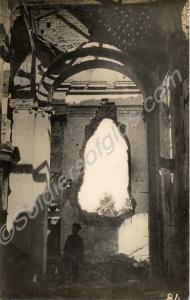 Soldier standing inside a ruined church. 1/4th Bat
