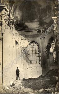 Soldier standing inside a ruined church. 1/4th Bat