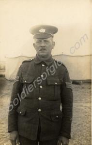 Portrait of a sergeant standing in front of a larg