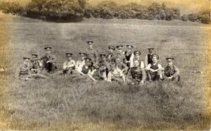 View of soldiers seated in field. (Probably 4th (T