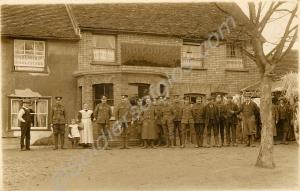 Soldiers and civilians standing outside an Ind Coo
