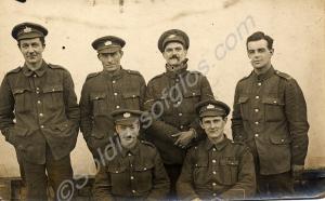 Group of soldiers with lance corporal smoking a pi