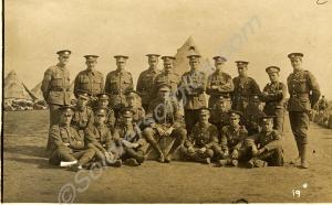 Group of soldiers with officer in camp. 1/4th Batt
